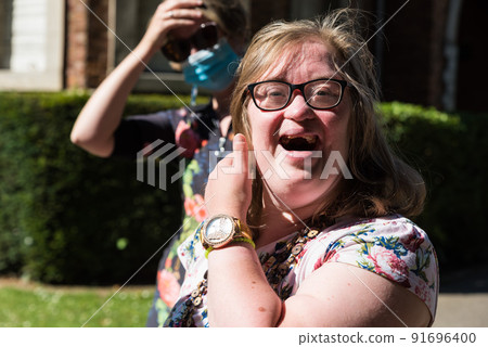 Portrait of a cute 38 year old girl with Down Syndrome 91696400