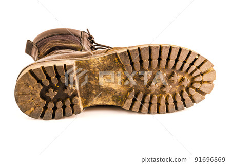 dirty military style light ankle boot isolated on white background dirty military style light ankle boot isolated on white background 91696869