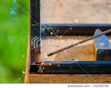 The tip of a hot electrode for electric arc welding. The tip of a hot electrode for electric arc welding. 91698706
