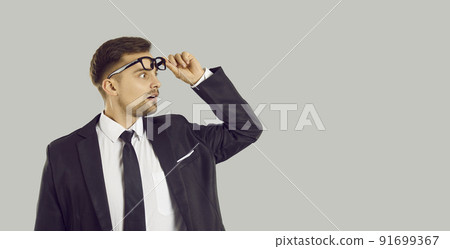 Amazed businessman shocked by business deal Amazed businessman shocked by business deal 91699367