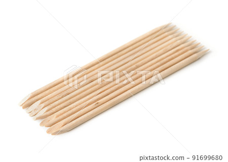 Group of orange wood sticks cuticle pushers 91699680