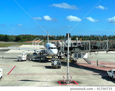 Airplane parking at passenger gate Prepare for serve passenger on journey by jet bridge. Airplane parking at passenger gate Prepare for serve passenger on journey by jet bridge. 91700735