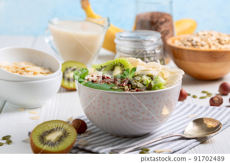 Green smoothie in bowl. Concept of healthy eating. 91702489