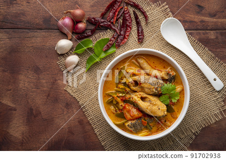 Tom yum pla,Creamy spicy soup with snake head fish tomato and mushroom,Thai hot and sour soup.Top view Tom yum pla,Creamy spicy soup with snake head fish tomato and mushroom,Thai hot and sour soup.Top view 91702938