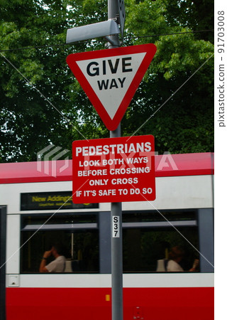 Warning sign at an unattended level crossing. London, UK. Warning sign at an unattended level crossing. London, UK. 91703008