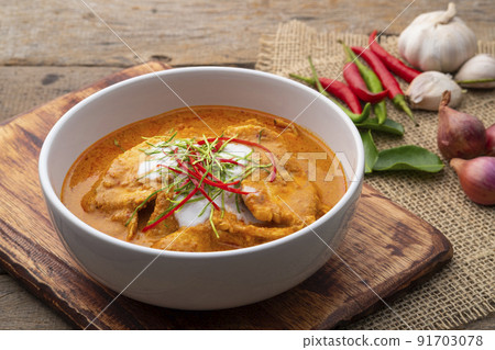 Panaeng Curry with chicken.Sliced chicken breast Meat in red curry paste and coconut milk,topping with coconut cream and Shredded kaffir lime leaves.Thai style food. 91703078