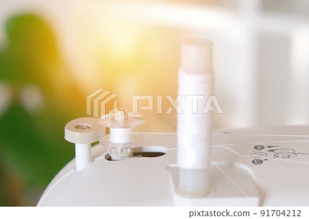 Winding threads on a bobbin on sewing machine. 91704212
