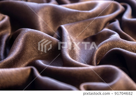 Chocolate colored fabric background, backdrop or elegant wallpaper design. Chocolate colored fabric background, backdrop or elegant wallpaper design. 91704682