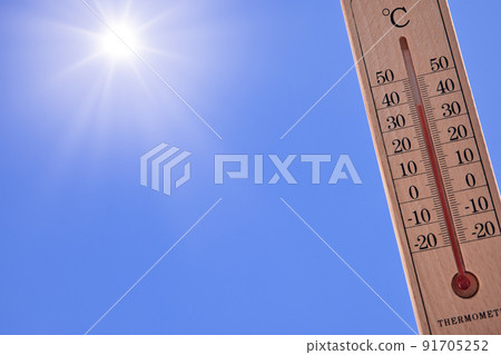 Extremely hot day: A thermometer with an outside temperature of 38 ° C, the sun and the blue sky Extremely hot day: A thermometer with an outside temperature of 38 ° C, the sun and the blue sky 91705252