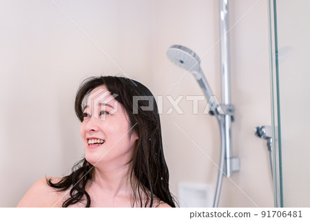 Young woman taking a shower Young woman taking a shower 91706481