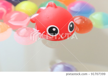 Cute goldfish and colorful bouncy balls 91707399