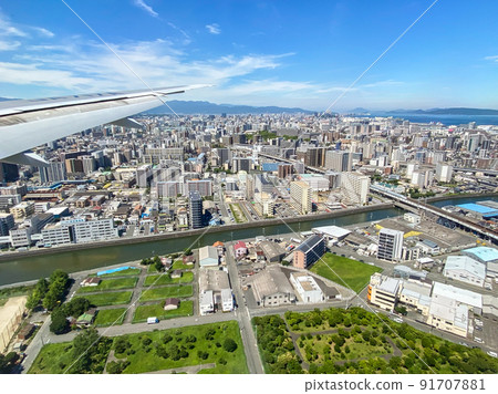 Fukuoka city seen from the cabin just before landing at Fukuoka Airport 91707881
