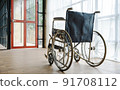 Close up view of empty wheelchair waiting for patient services with vintage filtered. 91708112