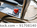 close up heart ball and stethoscope on empty wheelchair. 91708140
