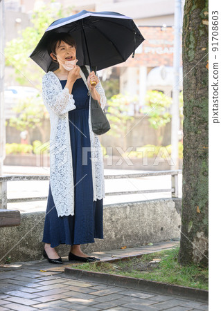 Woman with a parasol Woman with a parasol 91708603