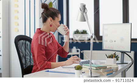 Company accountant analyzing business sales charts in startup office, planning development strategy. Project manager working with research data statistics on commercial graphs. Company accountant analyzing business sales charts in startup office, planning development strategy. Project manager working with research data statistics on commercial graphs. 91711024