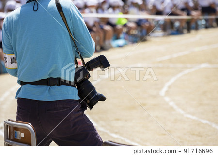 Photographer shooting athletic meet Photographer shooting athletic meet 91716696