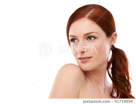 Theres a touch of elegance about her beauty. Studio shot of a redheaded woman isolated on white. Theres a touch of elegance about her beauty. Studio shot of a redheaded woman isolated on white. 91719894