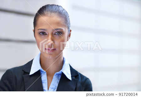 She means business. Portrait of a confident young businesswoman standing outside a building. 91720014