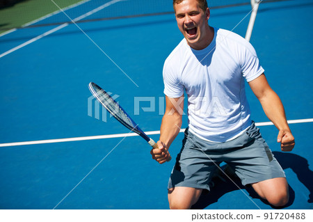 Winning. Shot of a man celebrating victory in a tennis match. Winning. Shot of a man celebrating victory in a tennis match. 91720488
