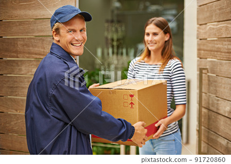 Handling your packages with care. Shot of a male courier delivering a package to a woman at her home. 91720860