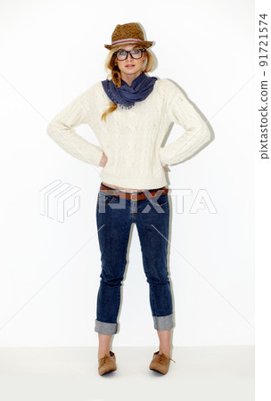 Casually waiting for her friends to arrive. Full length portrait of a stunning young woman with her hands on her hips. Casually waiting for her friends to arrive. Full length portrait of a stunning young woman with her hands on her hips. 91721574