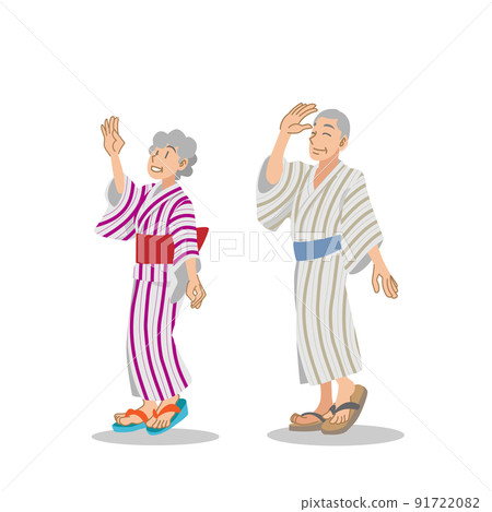An elderly couple wearing a yukata and enjoying Bon Odori 91722082