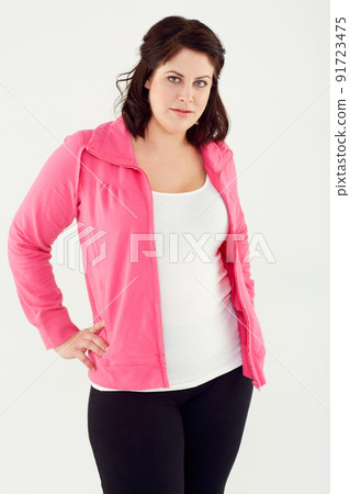 Working towards a healthier me. Studio shot of a young woman in exercise clothing isolated on white. 91723475