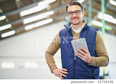 My little inventory friend. Portrait of a man with a digital tablet working in a distribution warehouse. 91728198