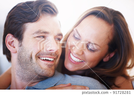 Vibrant young love. Closeup shot of a vibrant married couple being affectionate. 91728281