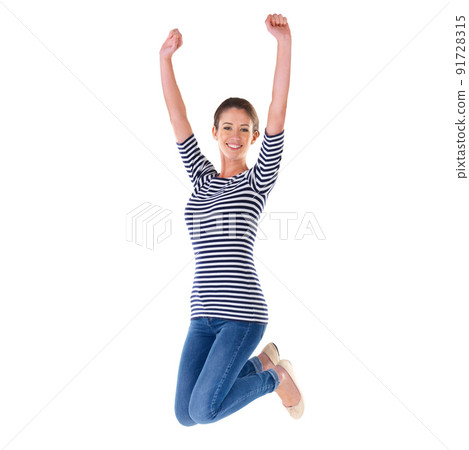 Jumping for joy. Studio shot of an ecstatic young woman jumping in the air isolated on white. 91728315