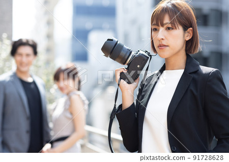 Cameraman shooting outdoors Cameraman shooting outdoors 91728628