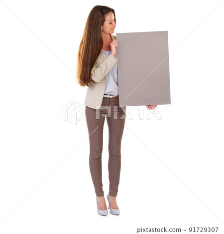 Lets get you noticed. Studio shot of a young businesswoman holding a blank field of tan copyspace. 91729307