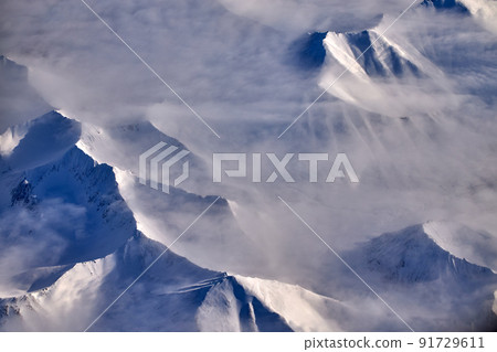 Mountain landscape, view from an airplane, Snowy panorama Mountain landscape, view from an airplane, Snowy panorama 91729611