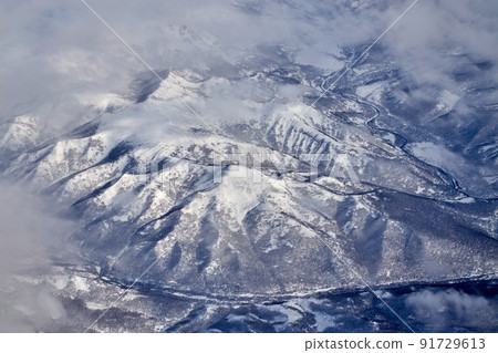 Mountain landscape, view from an airplane, Snowy panorama Mountain landscape, view from an airplane, Snowy panorama 91729613