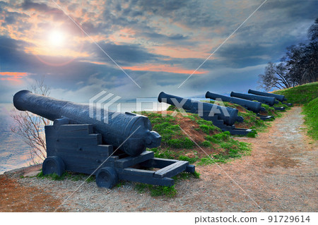 Artillery redoubt on the seashore. Cast iron ship medieval cannons. Artillery redoubt on the seashore. Cast iron ship medieval cannons. 91729614