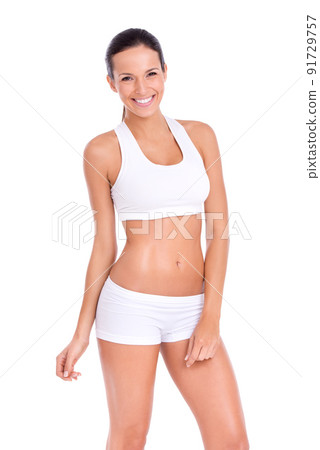 Looking this good doesn't come easily. Studio portraitt of a fit young woman isolated on white. Looking this good doesn't come easily. Studio portraitt of a fit young woman isolated on white. 91729757