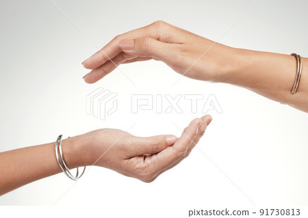 Support is a give and take. Cropped shot of two unrecognizable women posing with their hands cupped above each other. Support is a give and take. Cropped shot of two unrecognizable women posing with their hands cupped above each other. 91730813