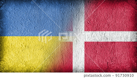 Ukrainian and Danish flag on concrete Ukrainian and Danish flag on concrete 91730910