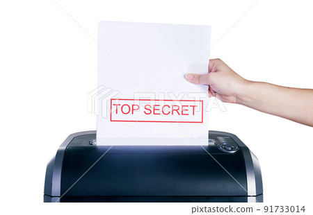 Getting rid of top secret information. Studio shot of a womans hand placing a confidential document into a shredder against a white background. Getting rid of top secret information. Studio shot of a womans hand placing a confidential document into a shredder against a white background. 91733014