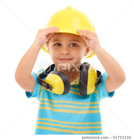 Bring on the noise. Studio shot of a cute young boy pretending to be a construction worker. Bring on the noise. Studio shot of a cute young boy pretending to be a construction worker. 91733130