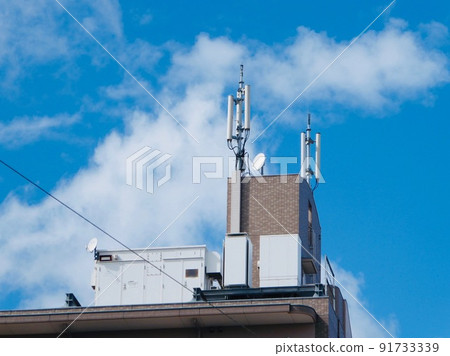 Mobile base station installed on the roof of an apartment Mobile base station installed on the roof of an apartment 91733339