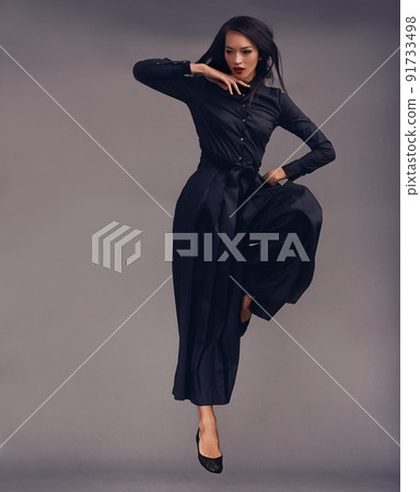 Shes a warrior. Studio shot of a beautiful young woman dressed in a martial arts outfit. 91733498