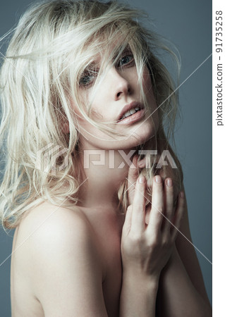 Shes a mystery to be unravelled. A naturally gorgeous woman posing naked in the studio. 91735258