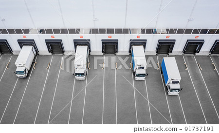 Small trucks unloading in distribution hub. Aerial view 91737191