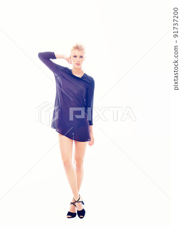 Confident me. Studio portrait of young attractive trendy confident blond woman looking forward. Confident me. Studio portrait of young attractive trendy confident blond woman looking forward. 91737200