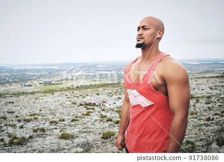 Music is a great motivator. Cropped shot of a muscular young man exercising outdoors. 91738086
