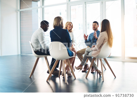 Putting their minds to work. Full length shot of a group of corporate colleagues meeting in their office. 91738730
