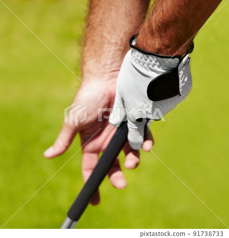The proper grip is important. Cropped image of a golfer demonstrating the proper grip. 91738733