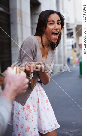 Help, Im being robbed. Young woman having her bag snatched by a criminal. Help, Im being robbed. Young woman having her bag snatched by a criminal. 91738961